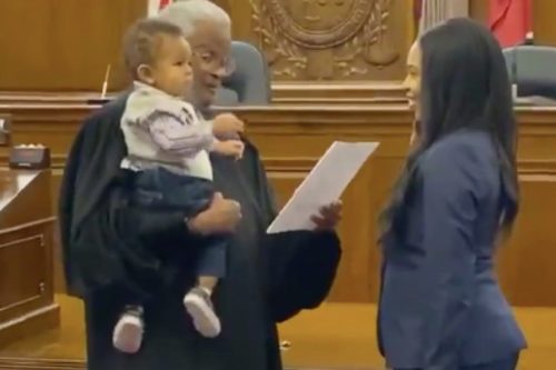 Watch This Awesome Judge Swear In A New Lawyer While Bouncing Her Baby On His Hip