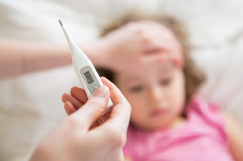 What temperature is considered a fever in children?