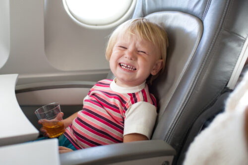 Who should clean up after kids on airplanes?