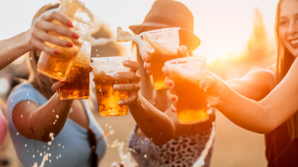 Friends toasting with beer