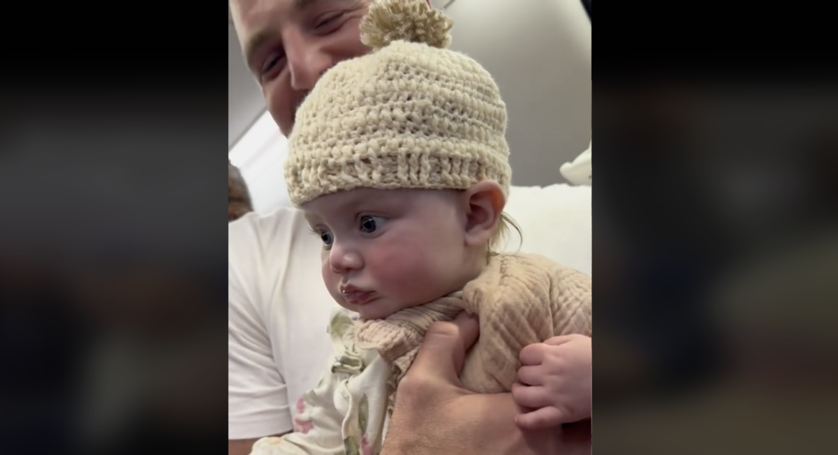 Passenger seated next to family crochets hat for baby taking her first flight